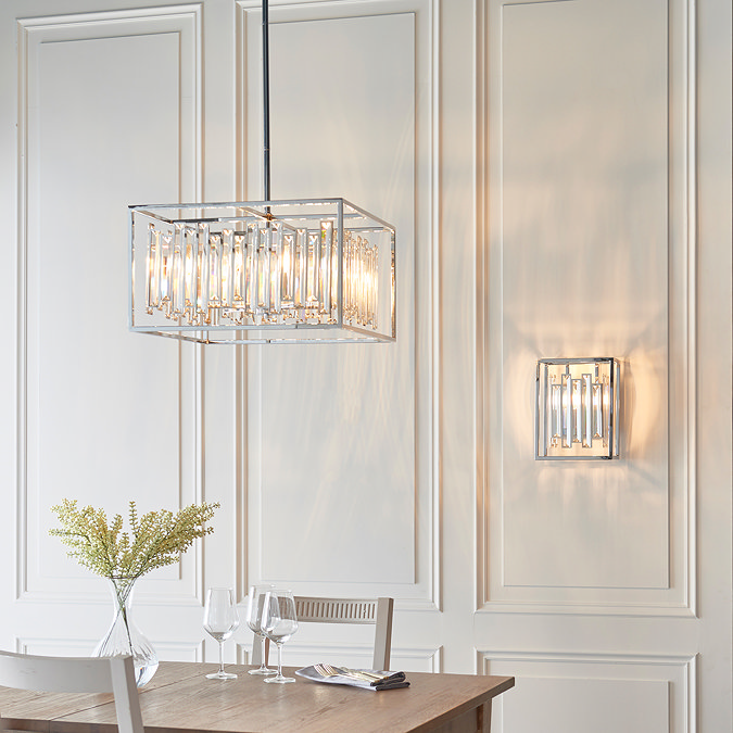 image of large cubed chrome and glass pendant light with matching wall light behind it and to the right