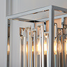 close up image of cubed chrome metalwork of wall light with bevelled glass edges