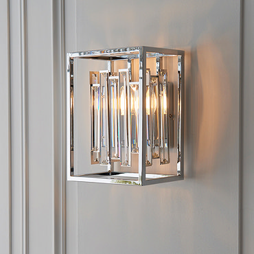 close up image of cubed chrome metalwork of wall light with bevelled glass edges