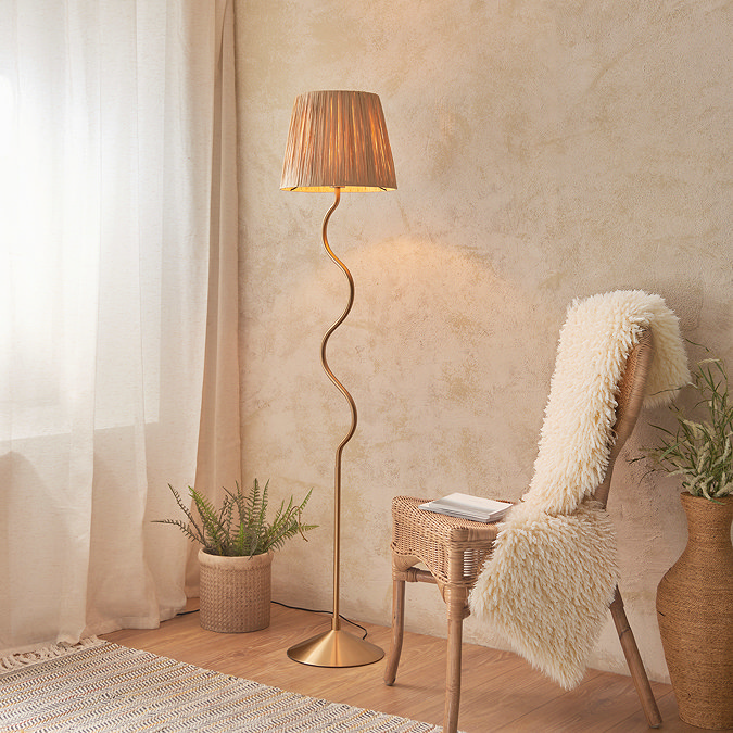 image of floor lamp with wiggle shaped brass body and textured shade
