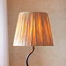 close up image on top of wriggle lamp with raffia lamp shade