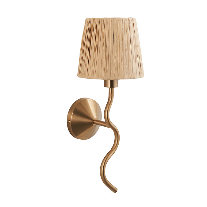 image cut out on white background of wriggle shaped wall light in brushed brass with raffia shade