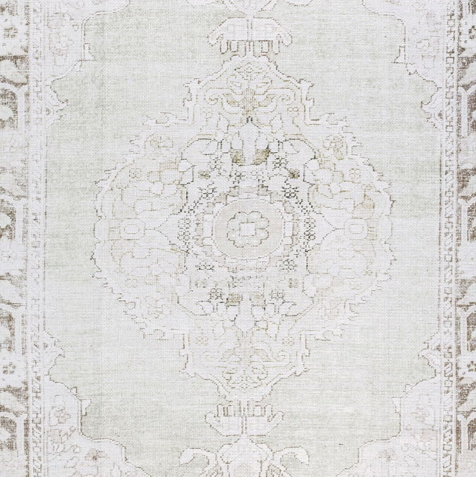 close up image of light sage floral vintage rug