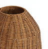 close up image of brown rattan lamp with circular space on top where light will emit from