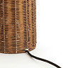 close up on base of brown rattan lamp with thin black cable extending from the back