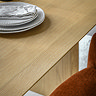 close up on smooth oak veneer surface of dining table