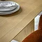 close up on smooth oak veneer surface of dining table