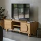 image of light oak veneer tv unit with two drawers and central open shelving, with tv on top.