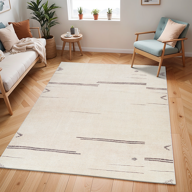 image of cream rug with charcoal line pattern on light wood flooring of modern apartment