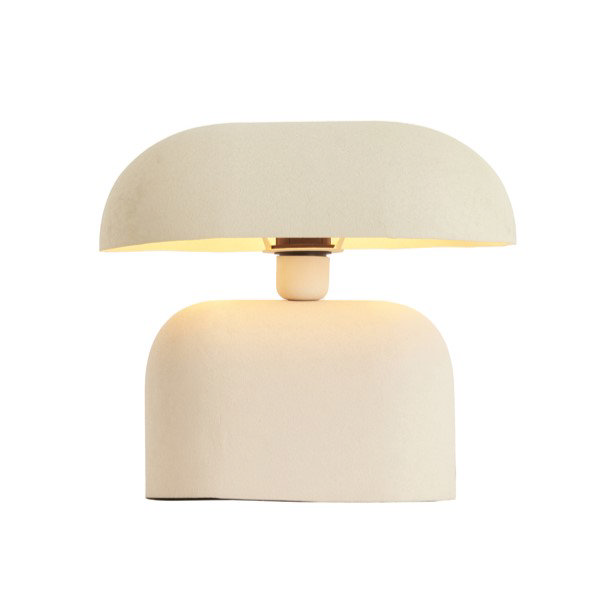 image cut out on white background of cream lamp with clean lines and switched on to emit warm glow
