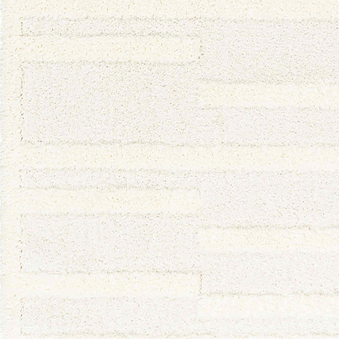 close up image on lined texture of super soft cream rug