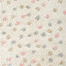 close up zoomed in image of cream super soft rug with multi coloured spots