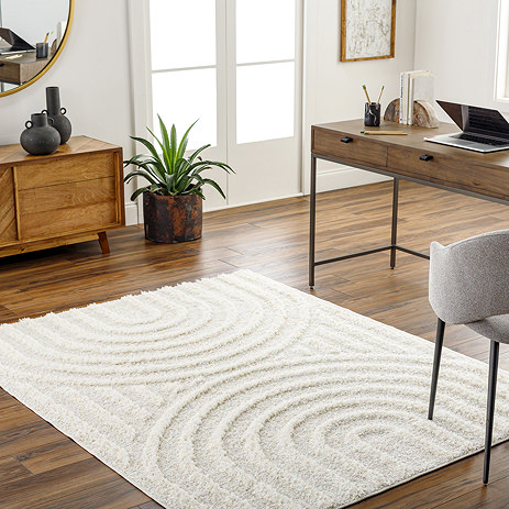 image of cream soft textured rug with arch pattern on either side, on wooden flooring of home office