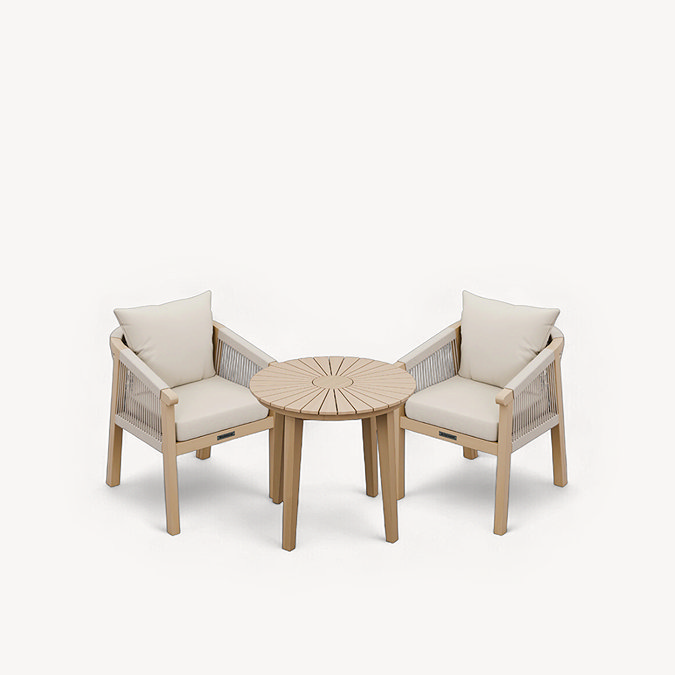 image cut out of woven rope dining chairs tucked under acacia wood bistro table