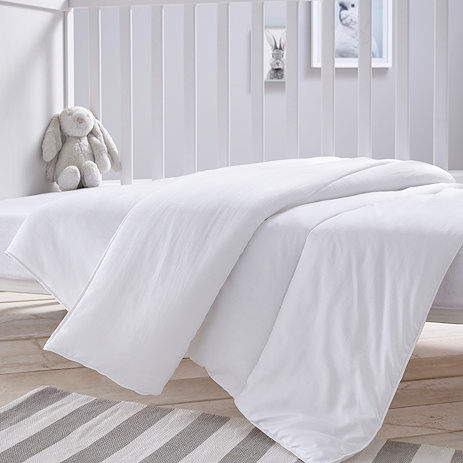 Safe Nights Cotbed duvet on bed image 1