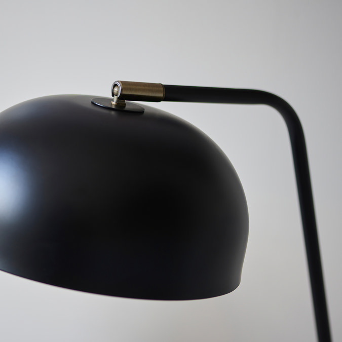 close up on matt black domed shade of table lamp