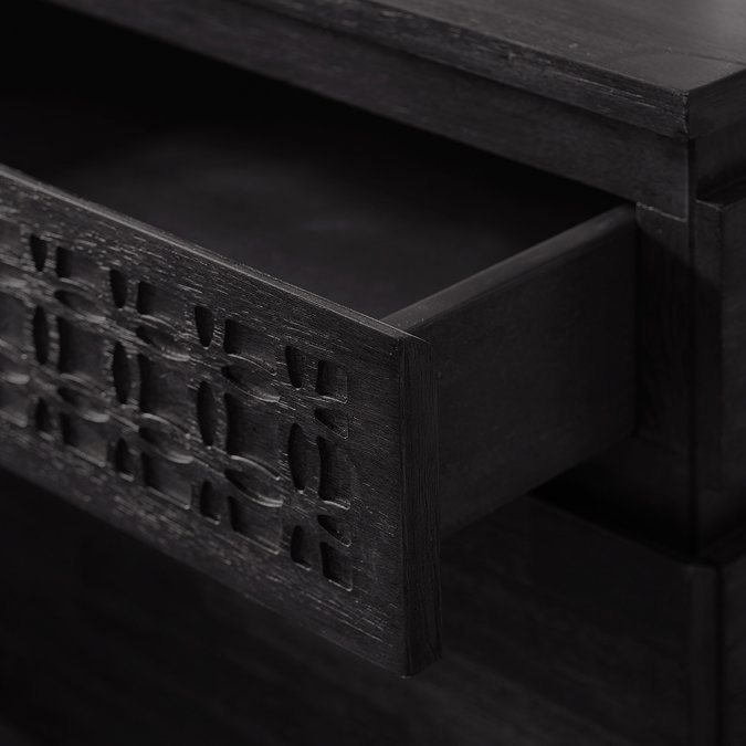 close up image of bohemian bedside table with top drawer pulled out