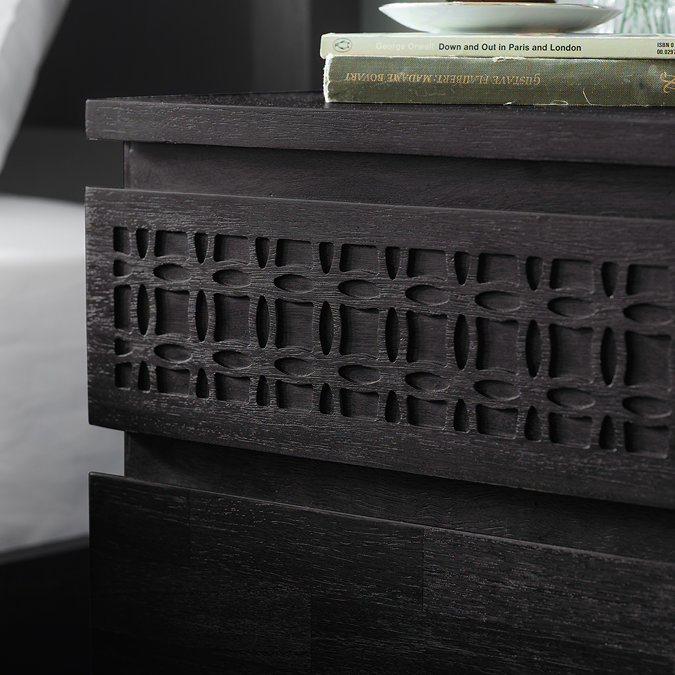 close up image of bohemian patterning on black bedside table top drawer