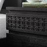 close up image of bohemian patterning on black bedside table top drawer