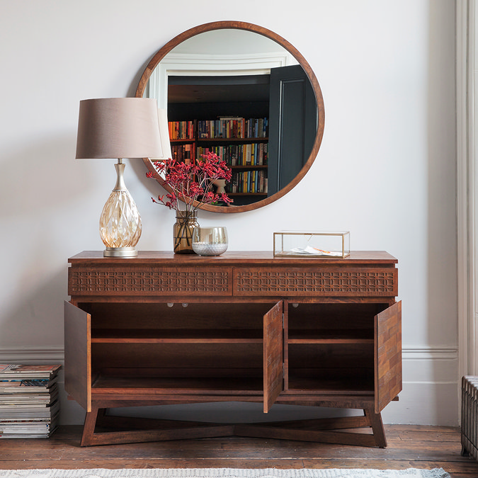 front on image of warm brown sideboard against wall with doors open to show shelf space inside