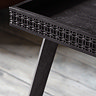 close up on bohemian frieze pattern of black coffee table