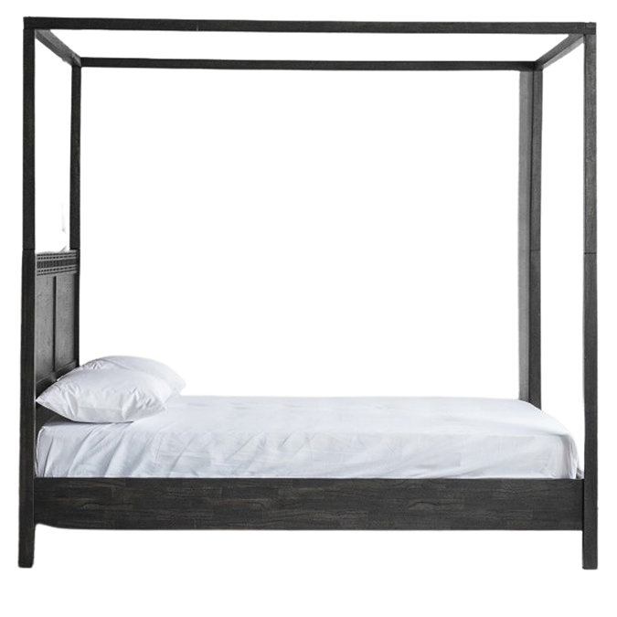 side on image cut out on white background of four poster black bed