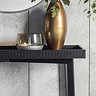 front on close up image of black wooden console table with frieze pattern