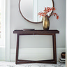 image of brown console table with frieze across the front and cross legs