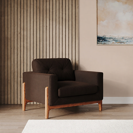 lifestyle image of cocoa velvet armchair with light ash feet