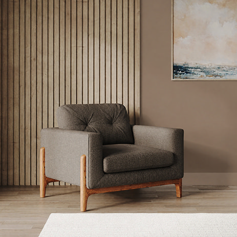 lifestyle image of fabric armchair with light ash feet