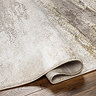 image of folded over edge of brown marble effect rug to suggest thickness
