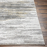 close up image of corner of grey abstract rug on wooden flooring
