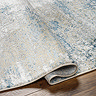 close up image on folded edge of teal rug