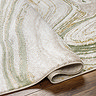 close up image on folded edge of sage marbled rug to indicate thickness/height