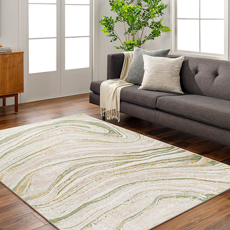 image of sage marbled rug in front of grey sofa in modern apartment room