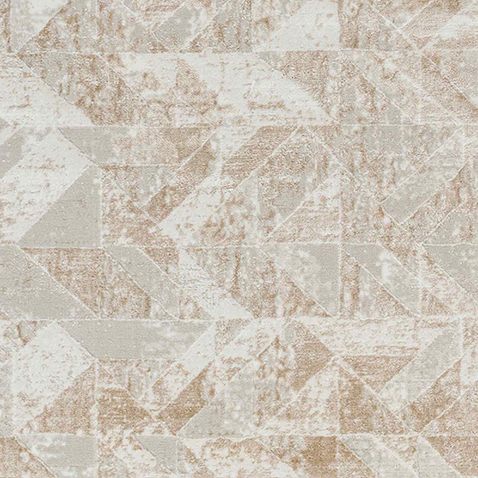 close up on pattern of tan and ivory geometric rug