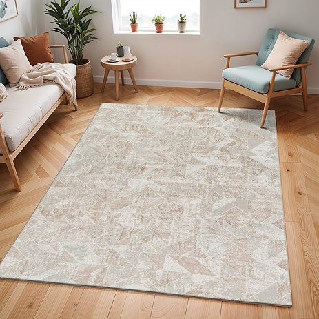 image of rectangular geometric patterned rug in tan and ivory colours, on light wooden flooring of apartment living room