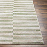 close up image on corner of striped modern green rug
