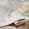 close up image of green marbled rug sightly folded over to suggest its thickness