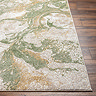 close up image of corner of green marbled rug on wooden flooring