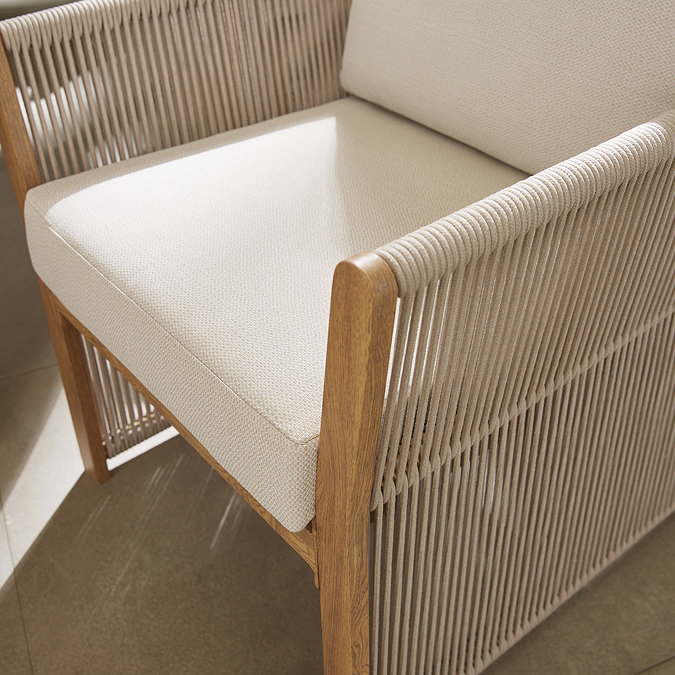 close up zoomed in image of rope backing on dining chair with cream seat cushions