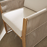 close up zoomed in image of rope backing on dining chair with cream seat cushions