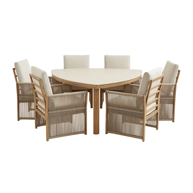 image cut out on white background of six seat dining table with rope backing, cream seat cushions, and light wood frames