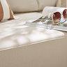 close up image on plush cream cushion of garden sofa