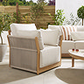 close up image of garden armchair with deep cream cushion and rope sides