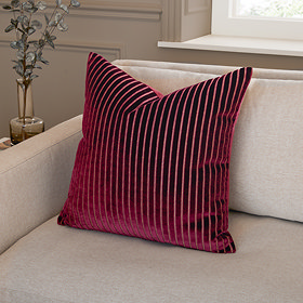 55x55cm burgundy red cushion with vertical stripe detail, sat in the corner of a cream sofa