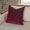 55x55cm burgundy red cushion with vertical stripe detail, sat in the corner of a cream sofa