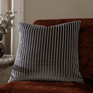 55x55cm charcoal grey cushion with vertical stripe detail, sat on rust orange armchair