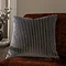 55x55cm charcoal grey cushion with vertical stripe detail, sat on rust orange armchair