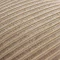 close up image of light brown velvet cushion with stripe detail pattern